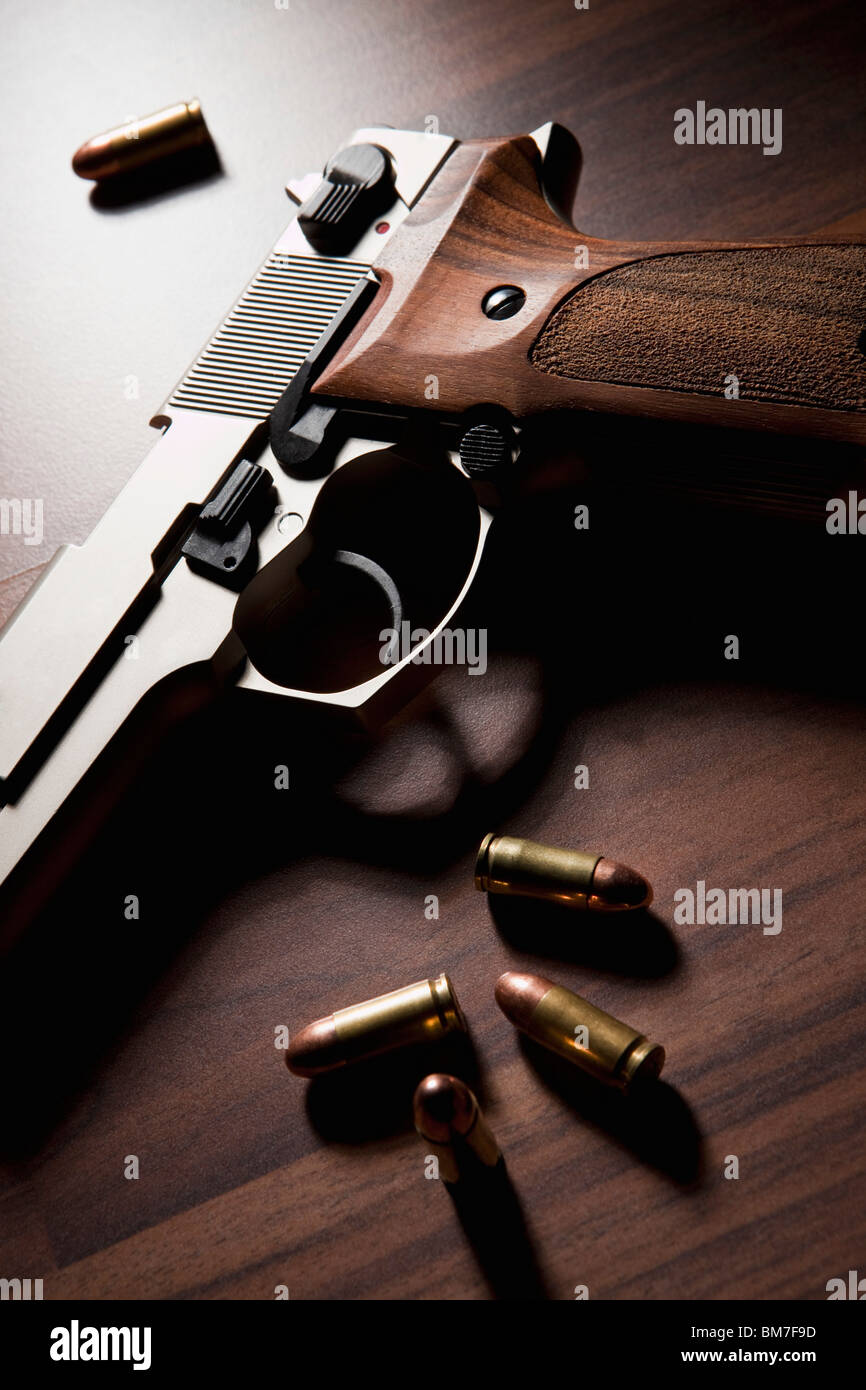 A Handgun With Bullets Stock Photo