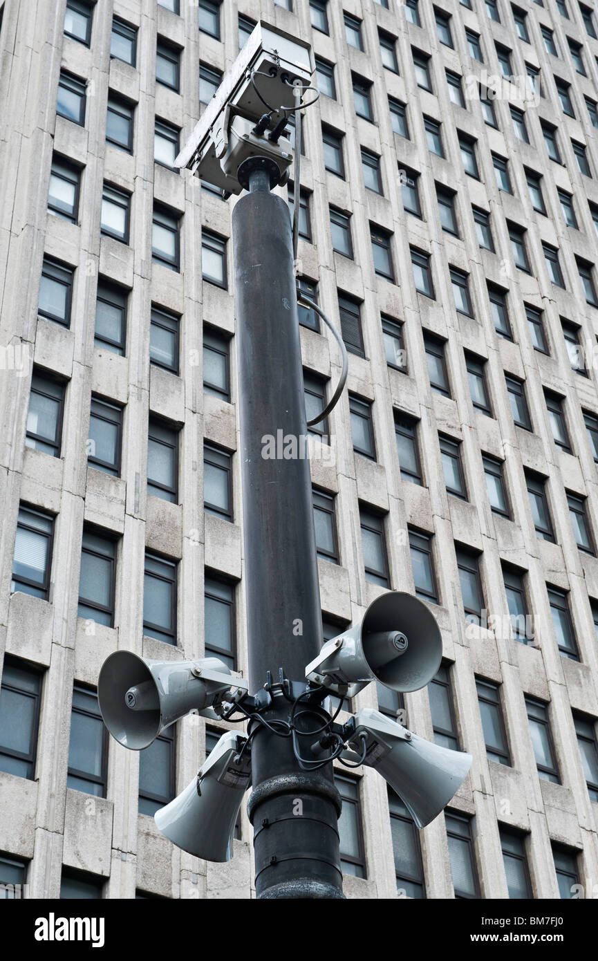 CCTV camera and speakers in front of a grim concrete office block on Sauchiehall Street, Glasgow, Scotland, UK Stock Photo