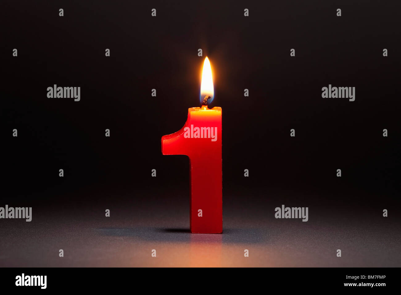 One Candle In The Shape Of The Number 1 Stock Photo