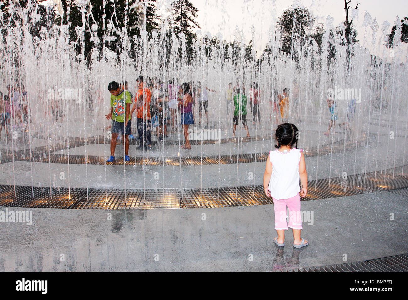 Children playing in one of the many fountains of the Magic Water Tour ,Park of the Reserve,Lima,Mexico Stock Photo