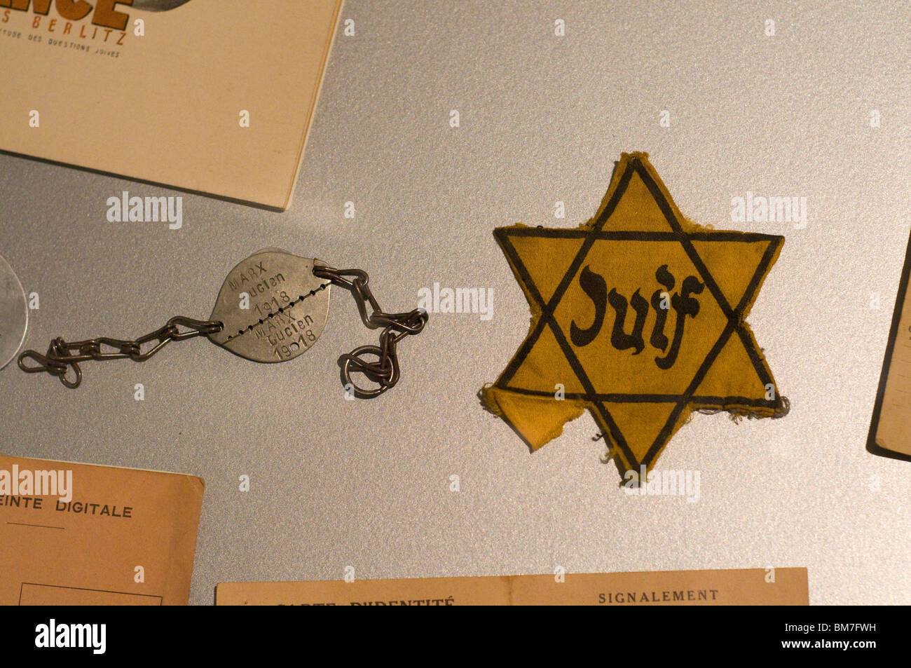 The yellow star, inscribed with the word Juif  Invalides Army Museum Paris, France Stock Photo