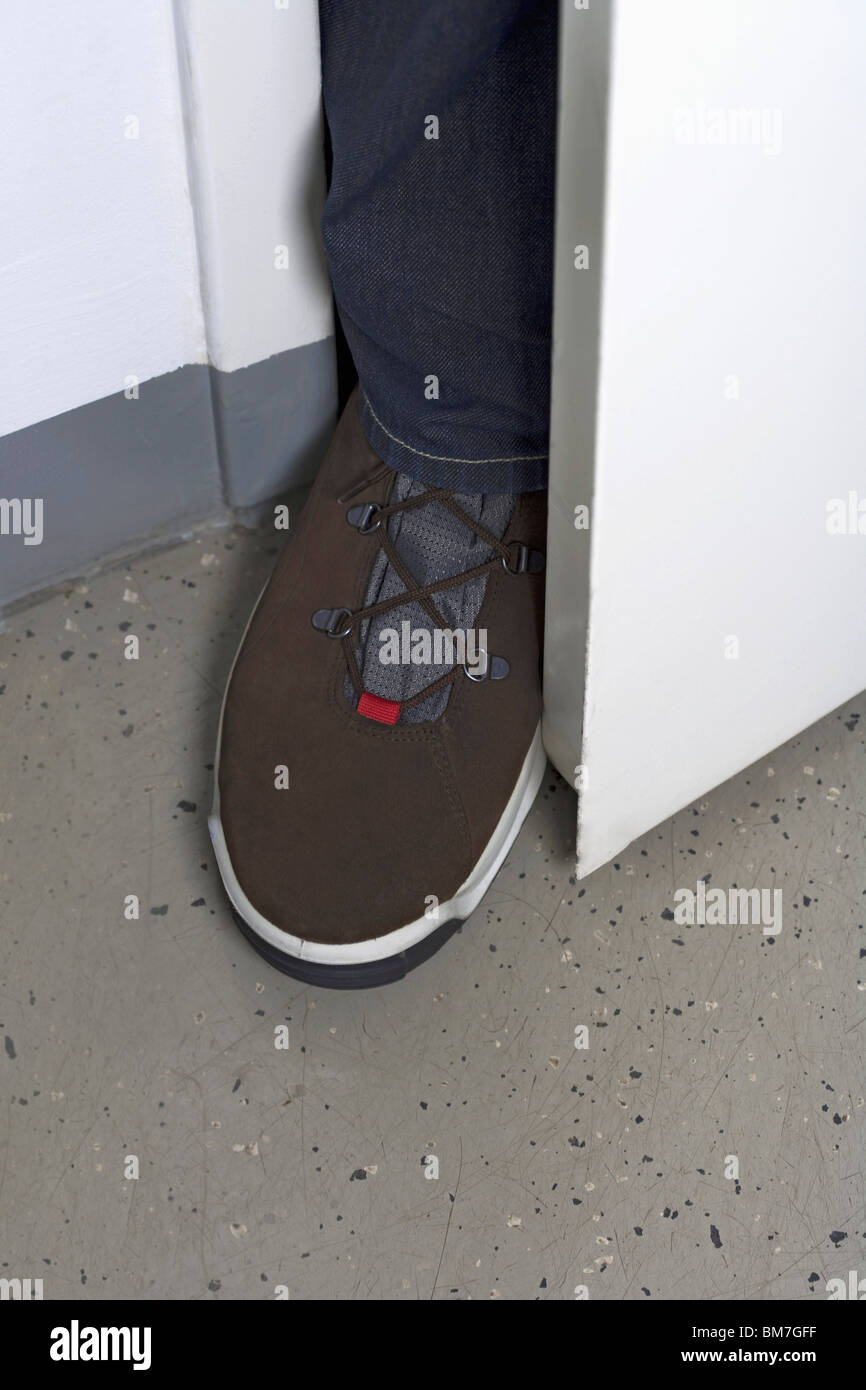 Foot in the door Stock Photo Alamy