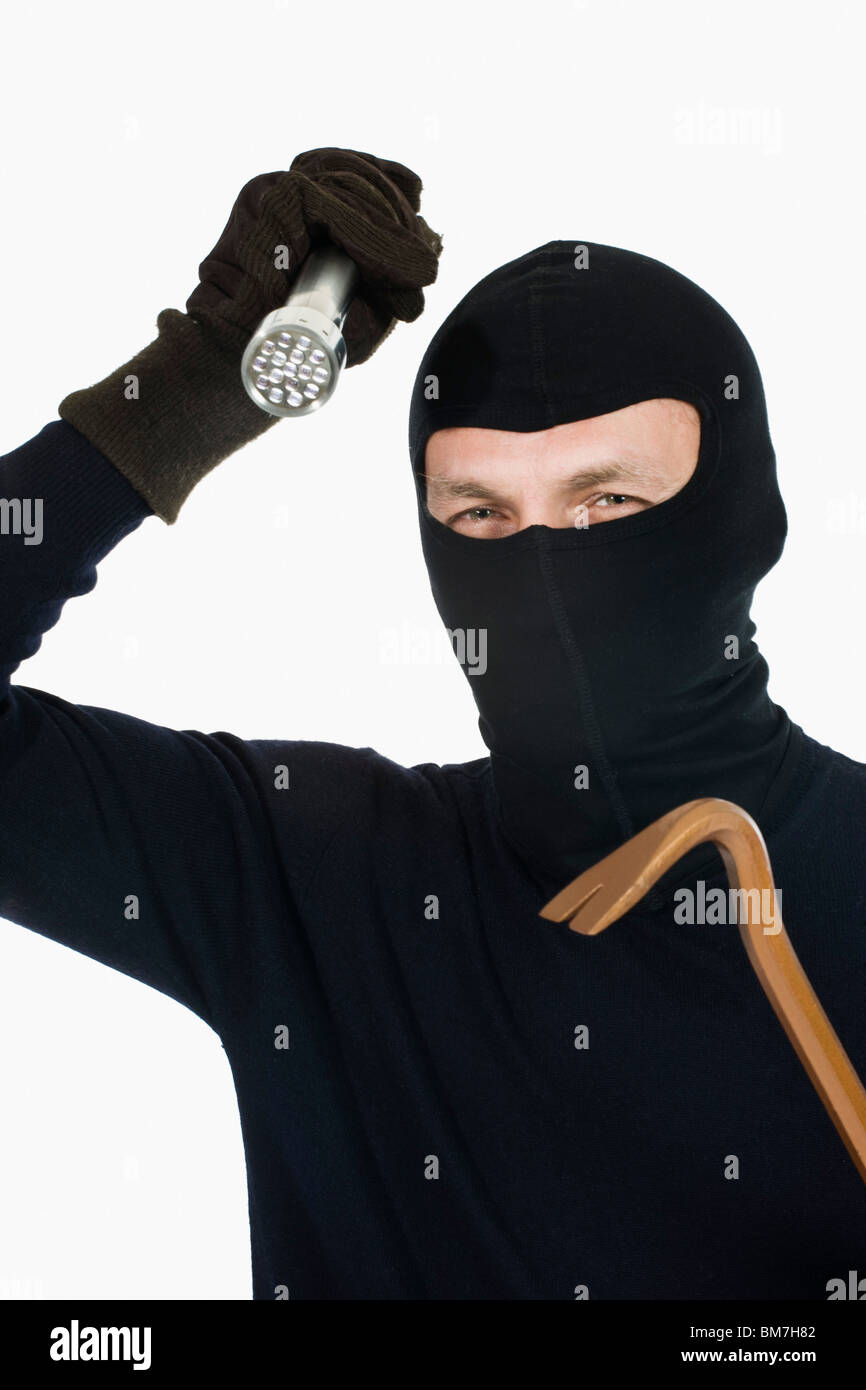A thief wearing a balaclava Stock Photo
