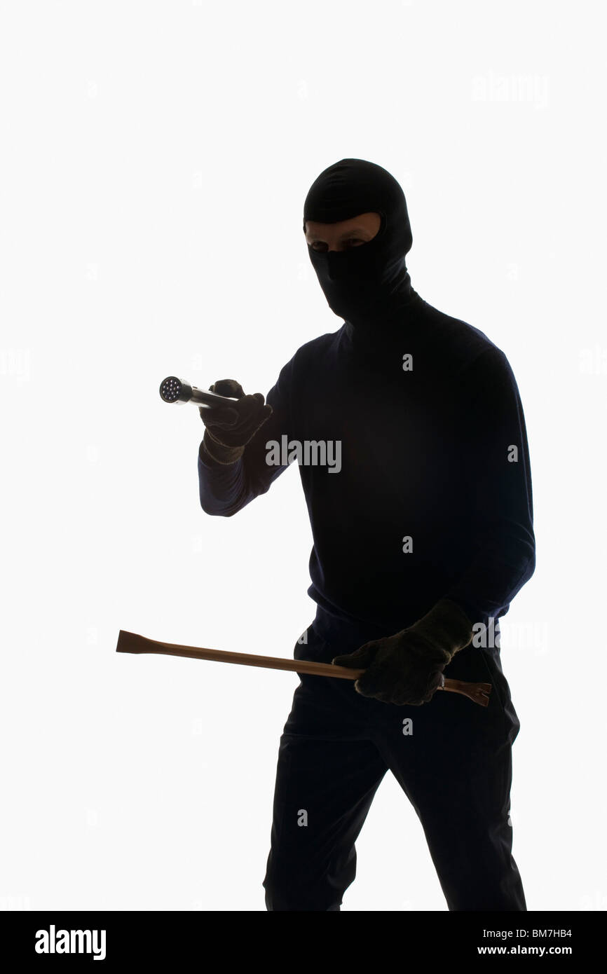 A thief wearing a balaclava Stock Photo