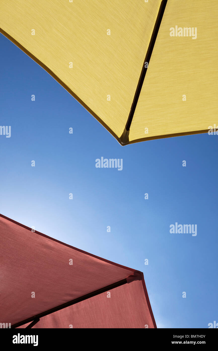 Two beach umbrellas, close-up, directly below Stock Photo