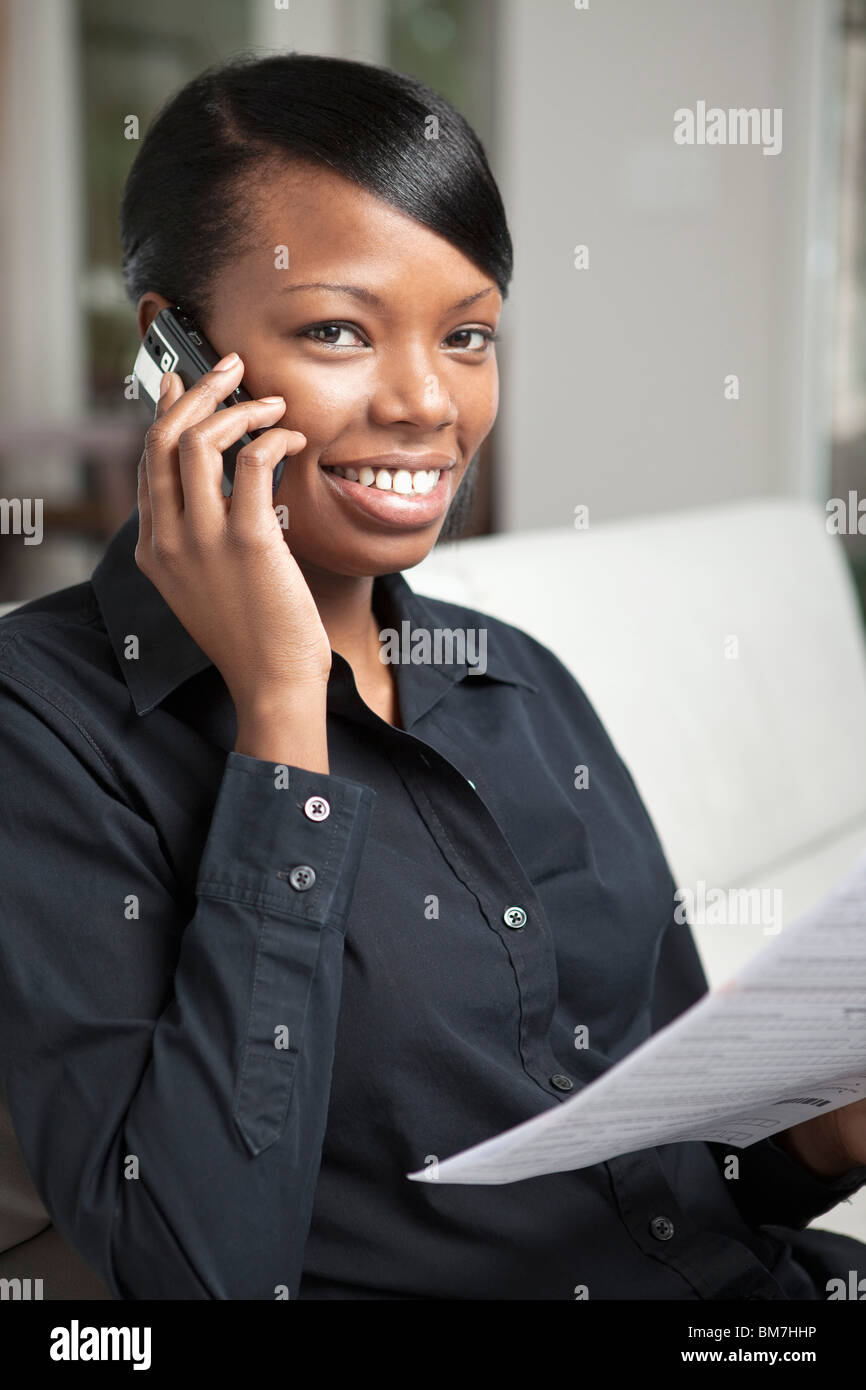 A businesswoman using a mobile phone Stock Photo