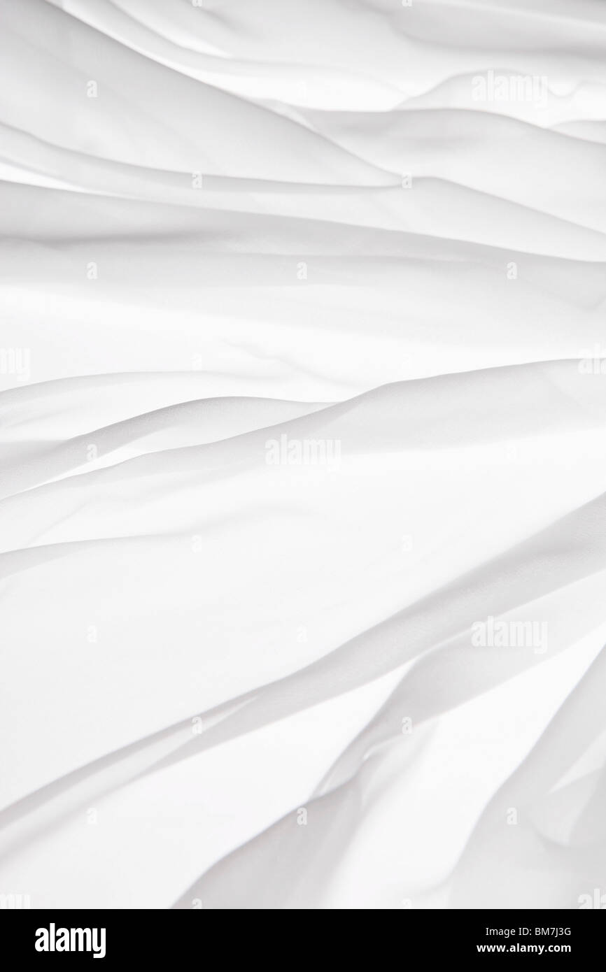 Detail of white fabric draped on a light box Stock Photo