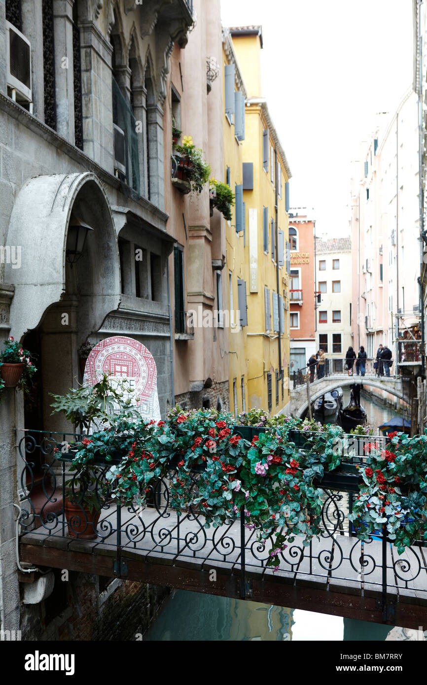 Beautiful bridge with flowers in Venice, Italy Stock Photo Alamy