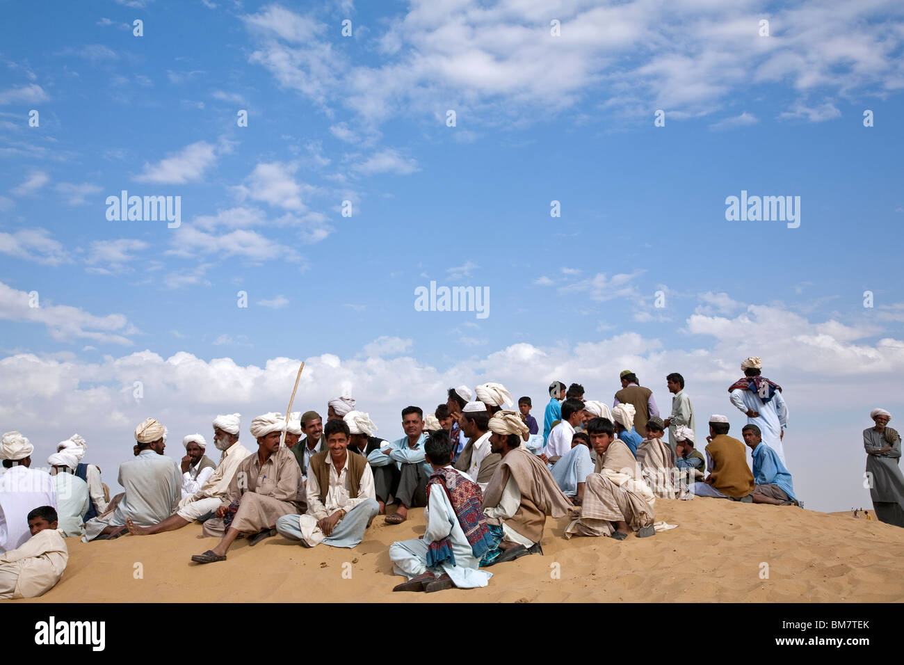 Indian men resting. Sam Sand Dunes National Park. Near Jaisalmer. Rajasthan. India Stock Photo