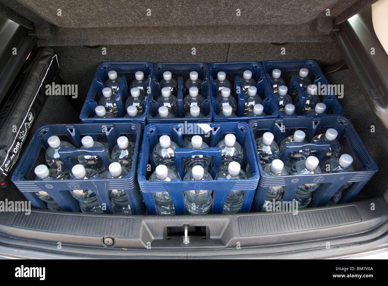 Six crates with mineral water in the boot of a car Stock Photo Alamy