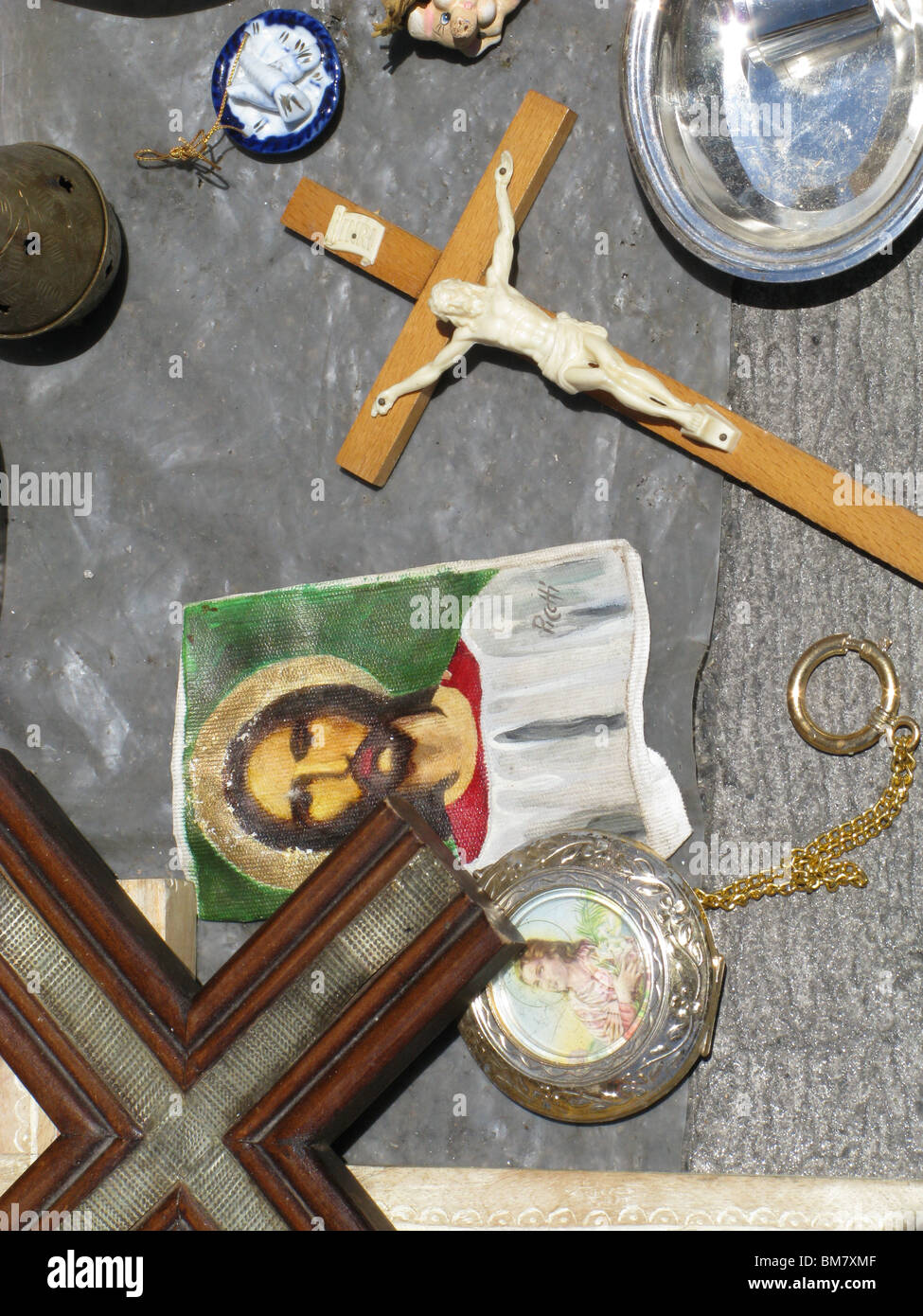 religious objects for sale on market stall in sun Stock Photo Alamy
