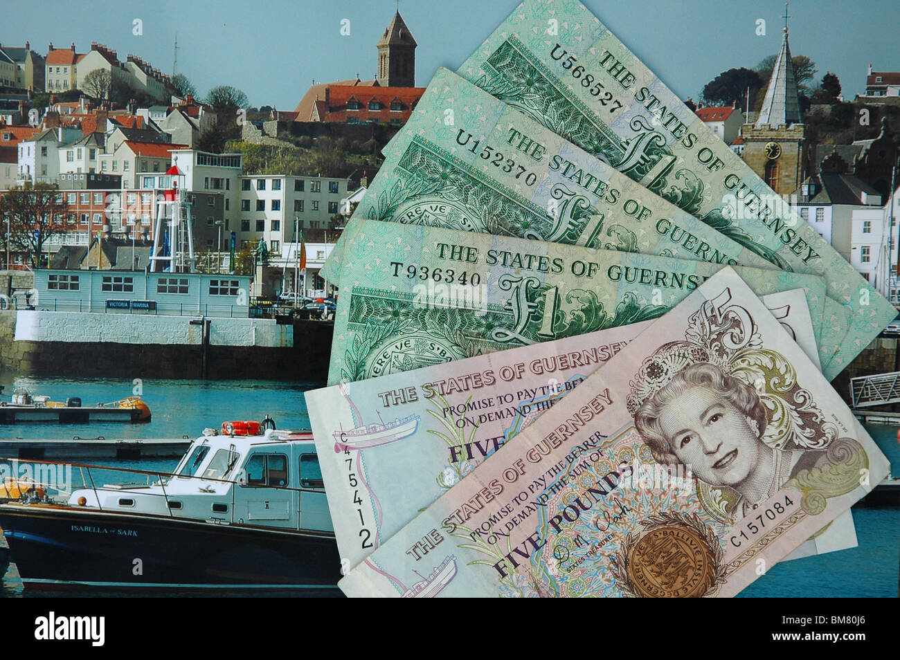 Channel Island currency, (Guernsey) displayed on photograph of St