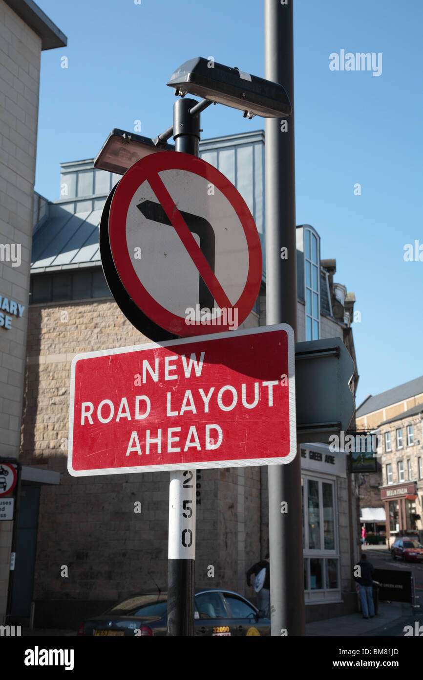 Road sign no left turn "New road layout ahead" Stock Photo