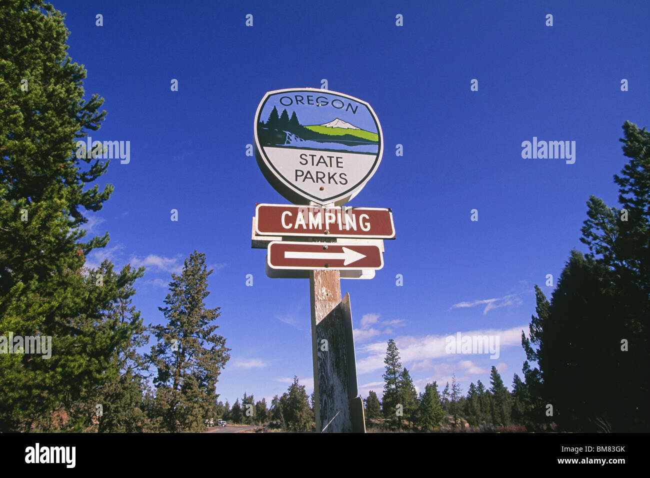 An Oregon State Park sign on a public road in a national forest in