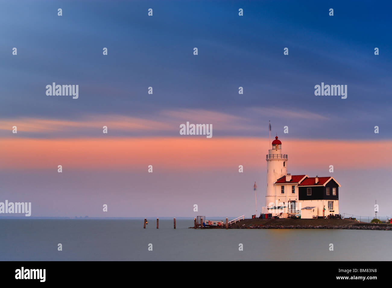 Lighthouse Paard van Marken at sunset Stock Photo