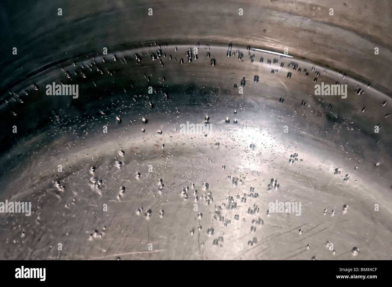 water in stainless steel pot beginning to boil Stock Photo Alamy