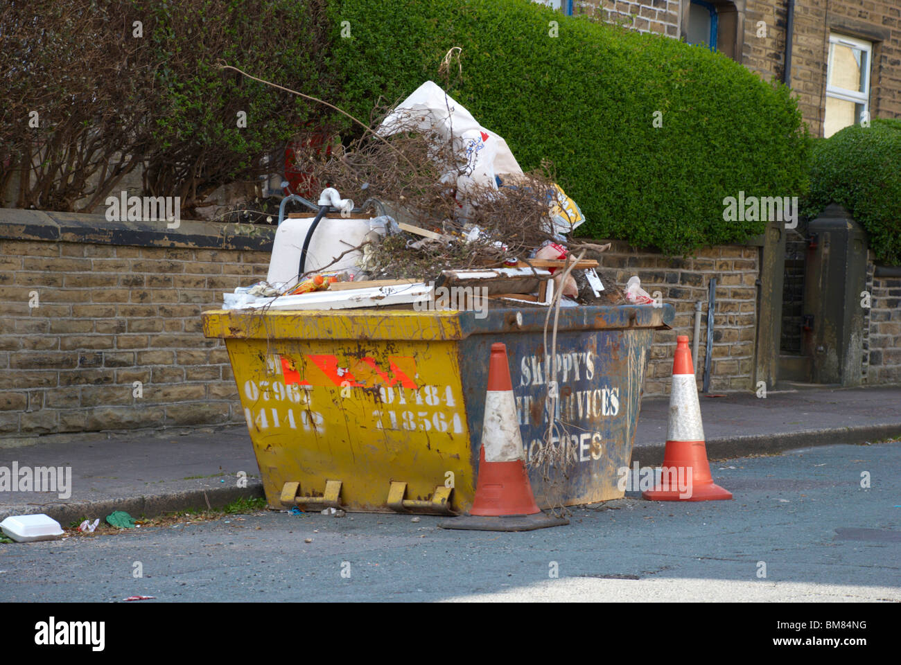 Overloaded skip hires stock photography and images Alamy