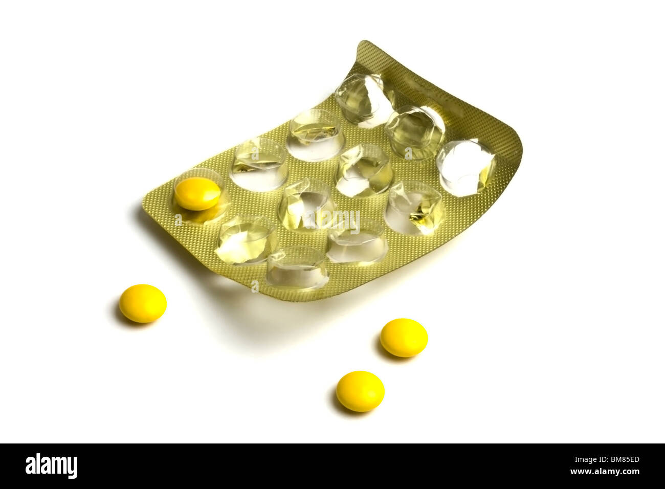 Package of Yellow Pills isolated on white background Stock Photo - Alamy