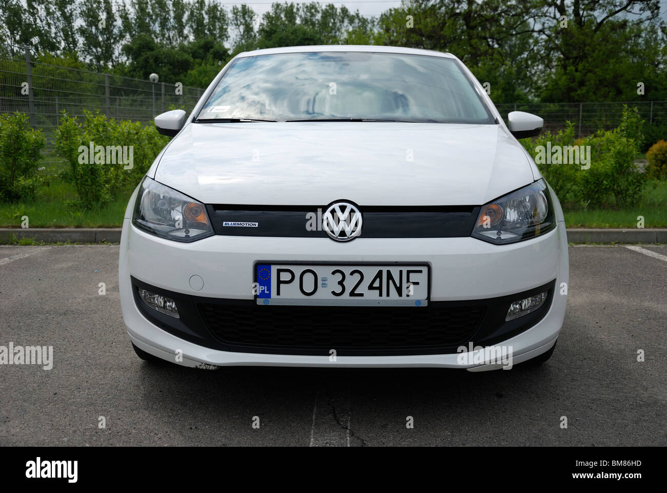 Polo 1.2 TDI BlueMotion - MY 2010 - white - five doors (5D) - German subcompact city car - parking space Stock Photo - Alamy