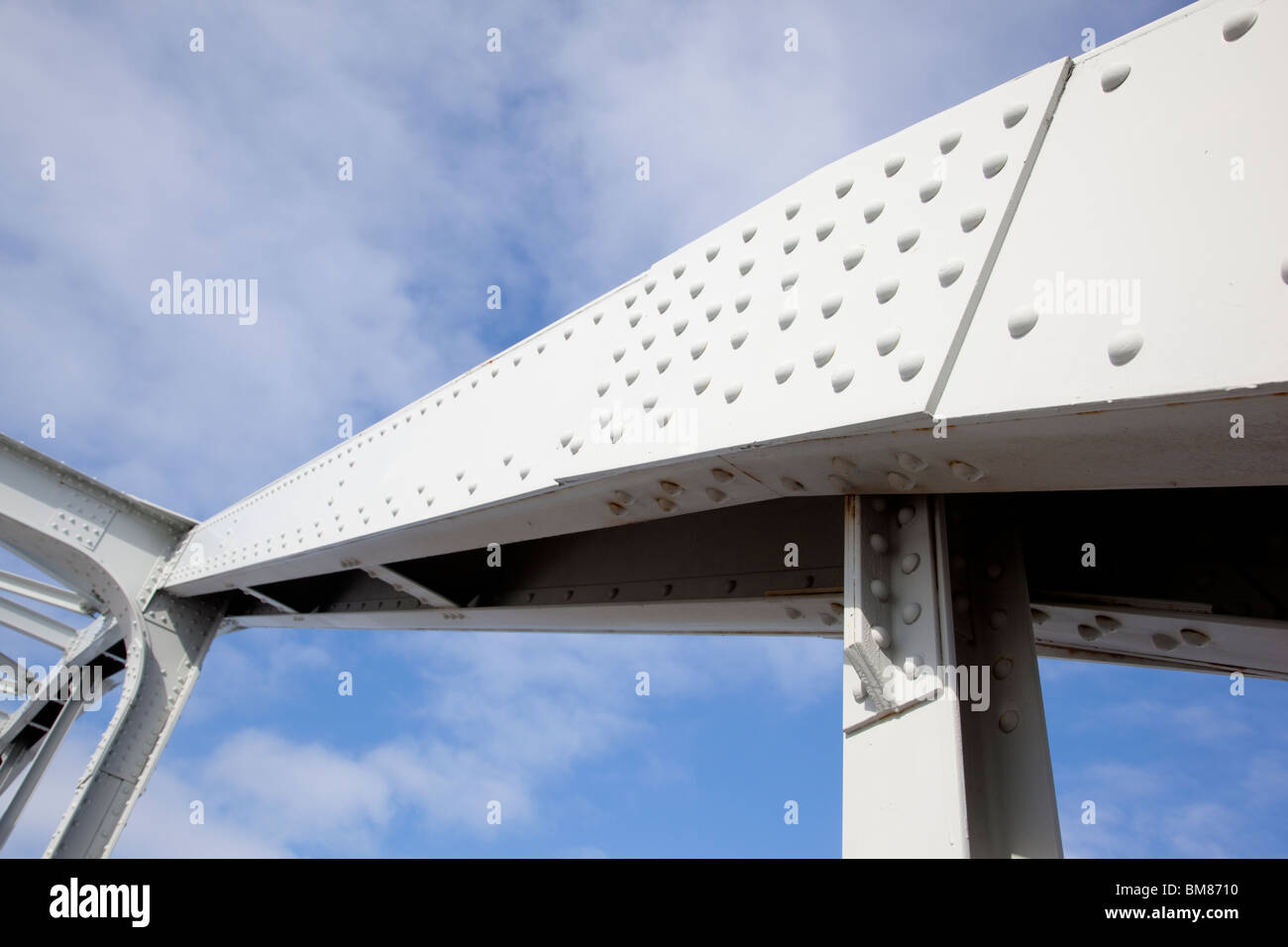 Riveted steel beam and joint at a steel bridge support structure Stock Photo