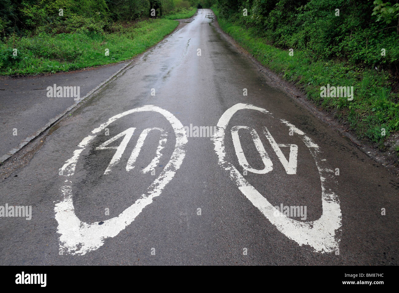 Elongated 40 mph speed limit markings on a road near Wendover, in the Chiltern Hills, Buckinghamshire, UK. Stock Photo