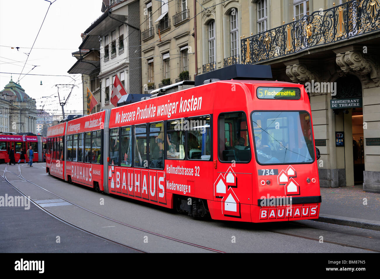 A red tram in the UNESCO world heritage site of Bern the capital city ...