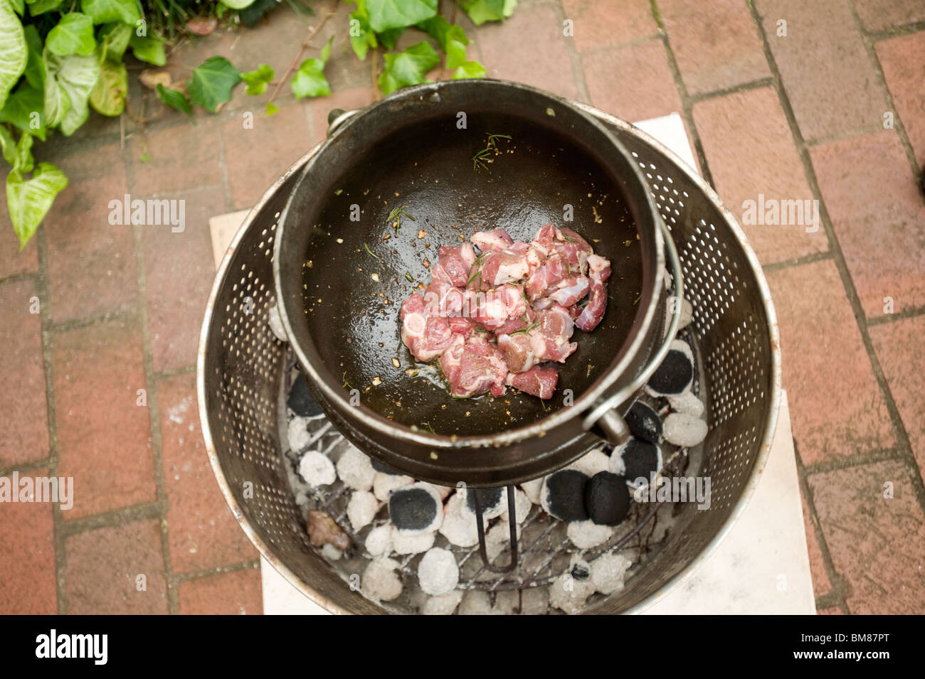 A potjiekos, or dutch oven, is used in a traditional South African