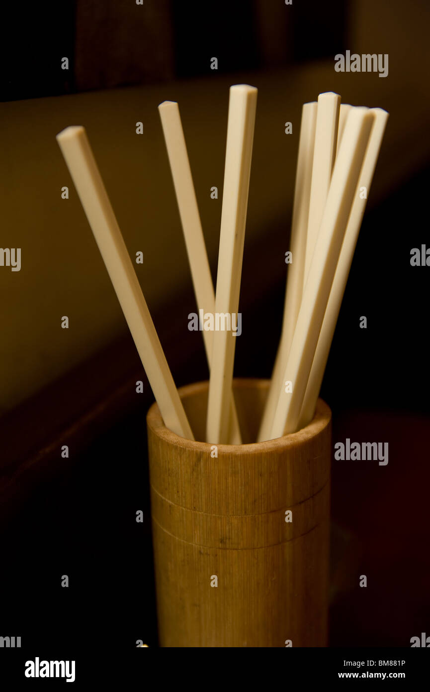 Bamboo cup filled with chopsticks at a noodle restaurant in the Haight Ashbury District of San Francisco California Stock Photo