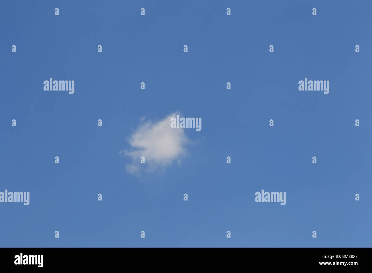 Fluffy white cumulus cloud in blue sky, England Stock Photo - Alamy