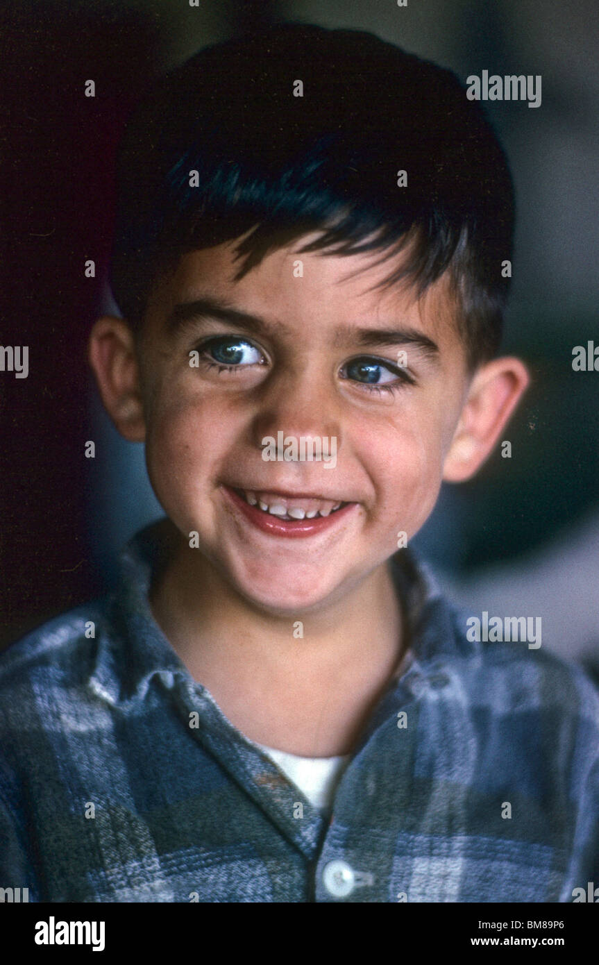 Little white boy with big charming smile portrait face cute happy laugh