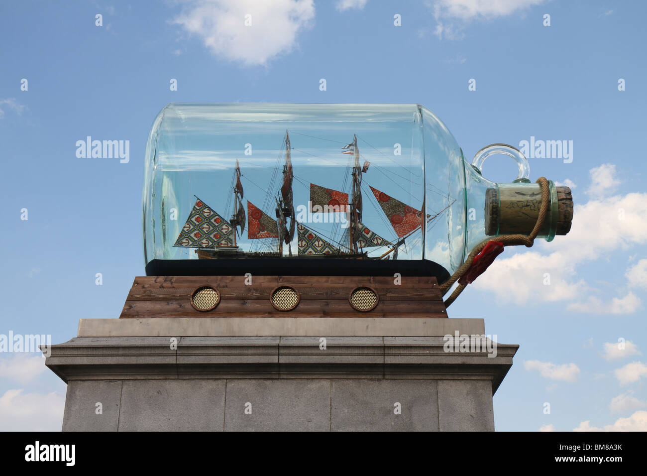 Side view of the fourth plinth at Trafalgar Square showing the new 'Nelson's Ship in a Bottle' installation on a sunny day Stock Photo