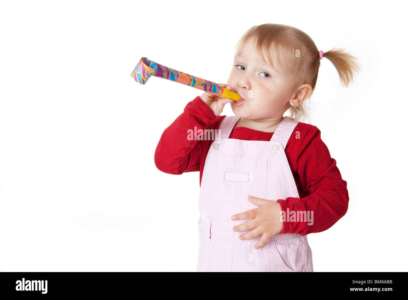 the little girl with party blower Stock Photo - Alamy