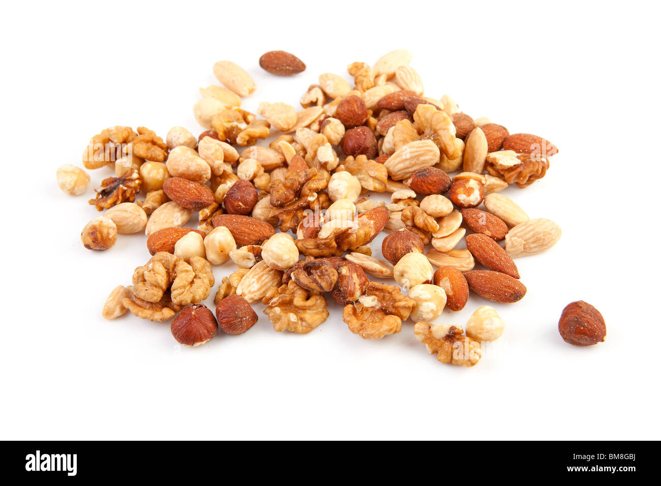 pile of raw mixed nuts isolated on white background Stock Photo