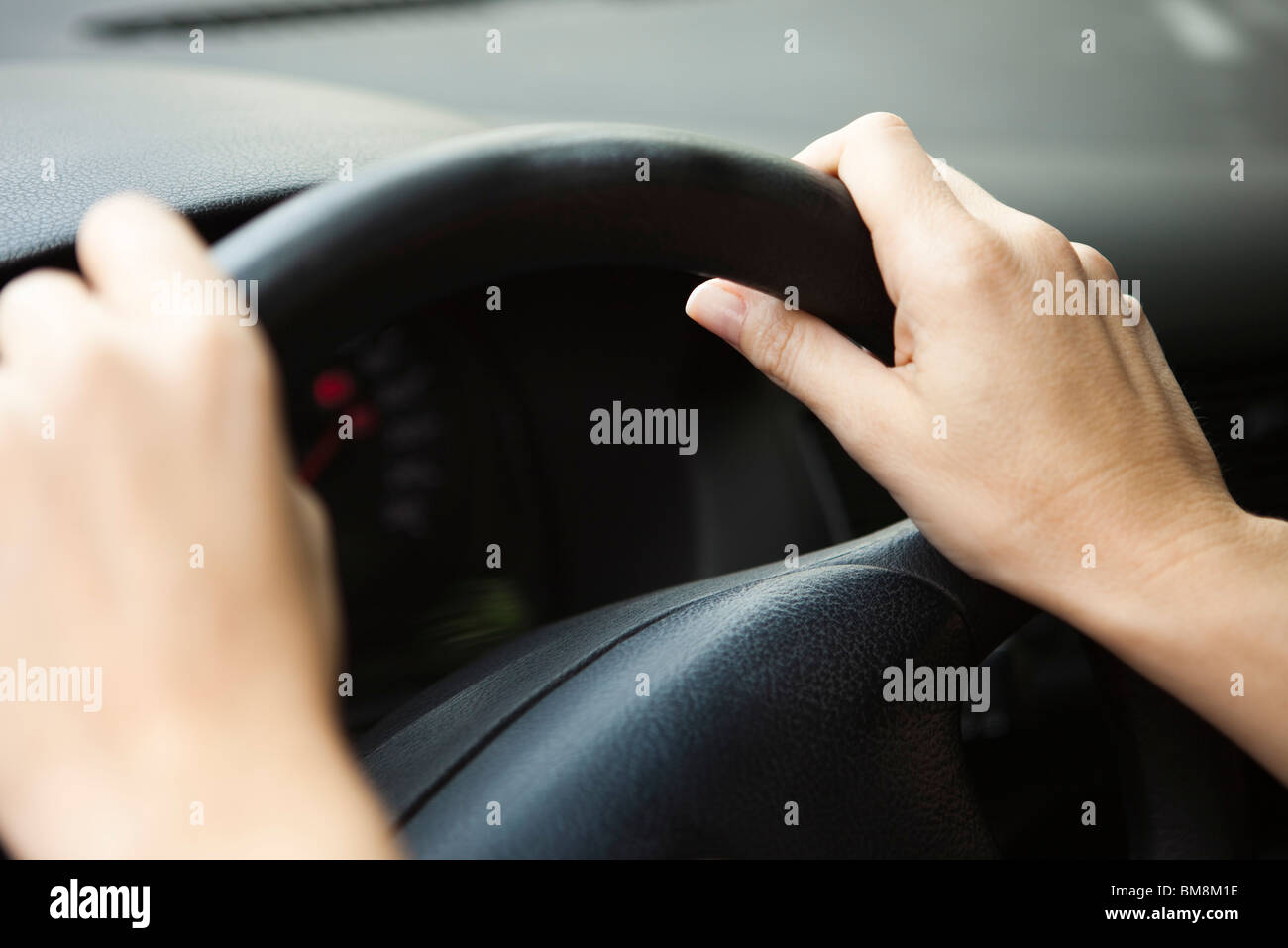 Driver with hands on the steering wheel Stock Photo - Alamy