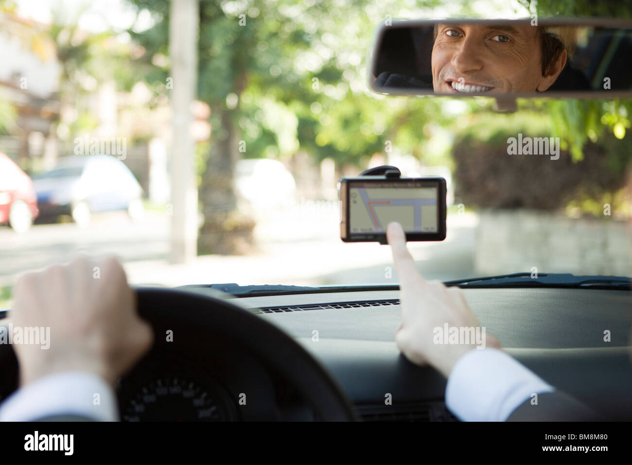 Driver using GPS for navigation assistance Stock Photo Alamy