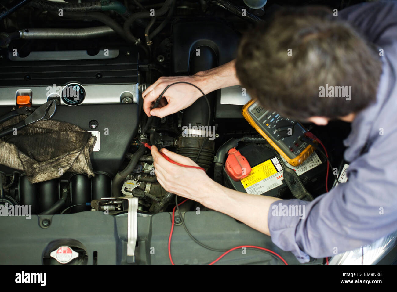 Mechanic diagnosing car engine problem Stock Photo Alamy