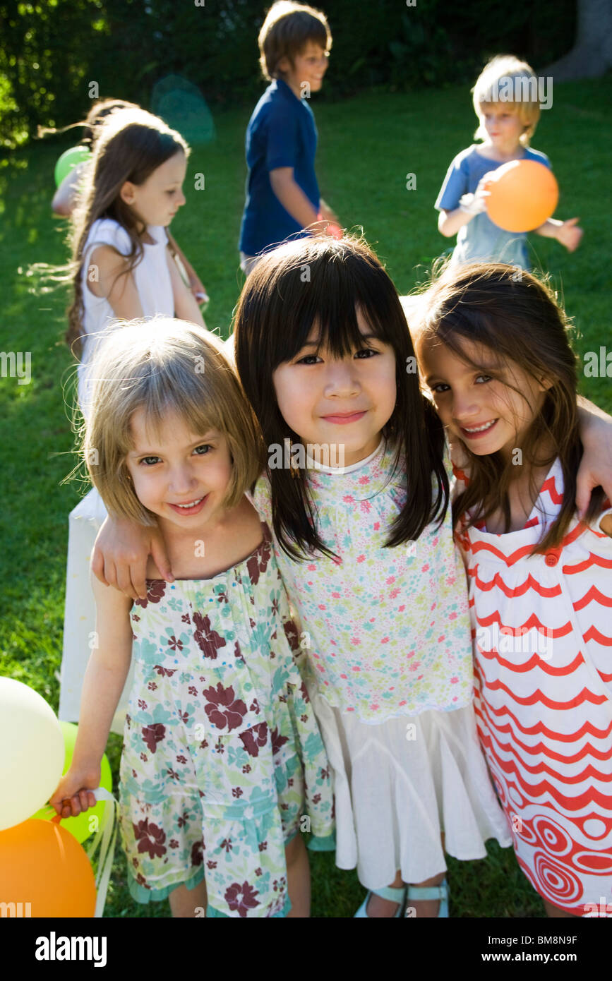 Childhood friends at outdoor party, portrait Stock Photo
