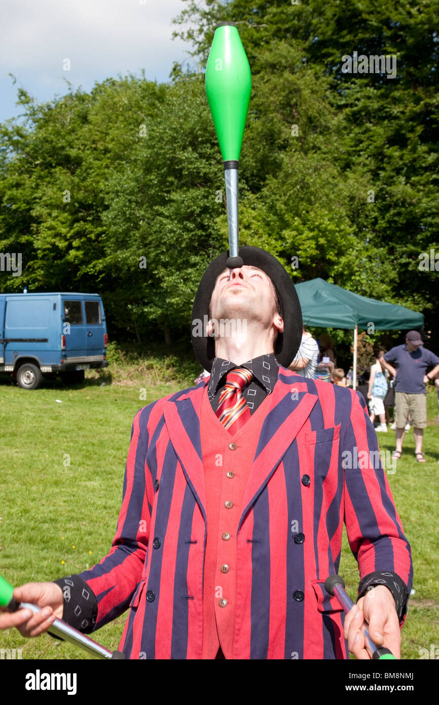 Juggler with club on nose, Killarney, Ireland Stock Photo