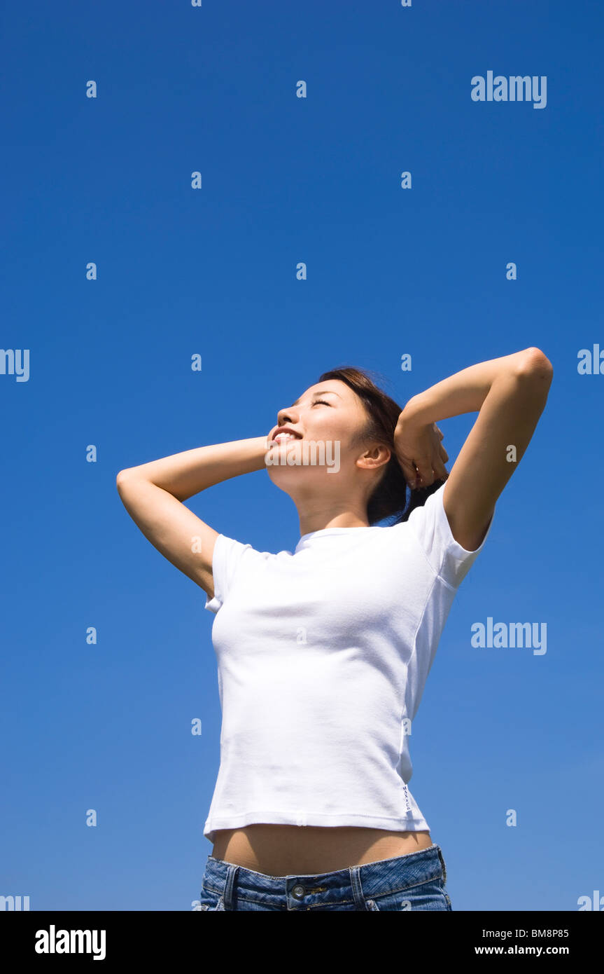 Young woman standing outdoors Stock Photo