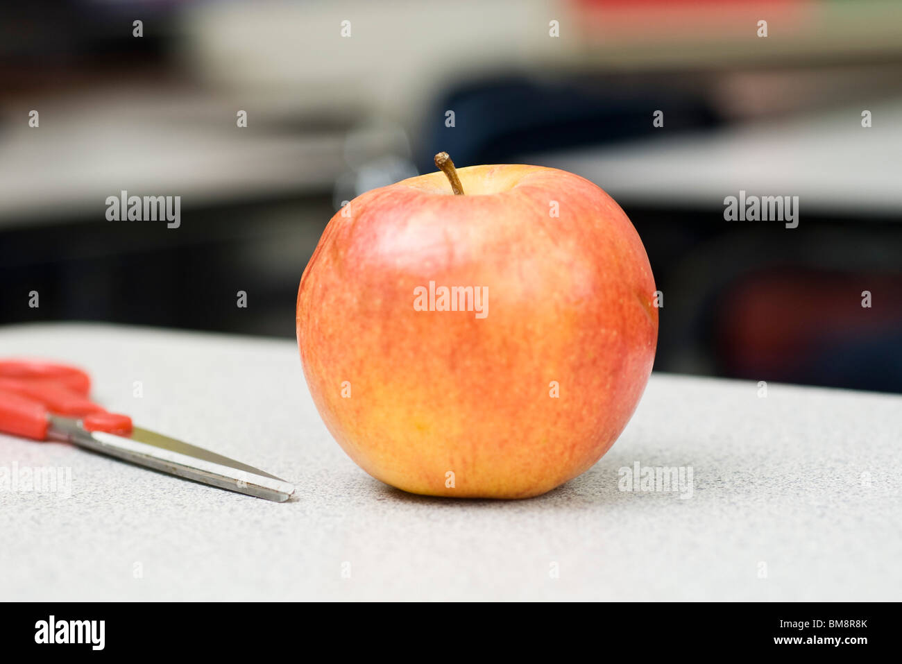 Apple on school desk Stock Photo