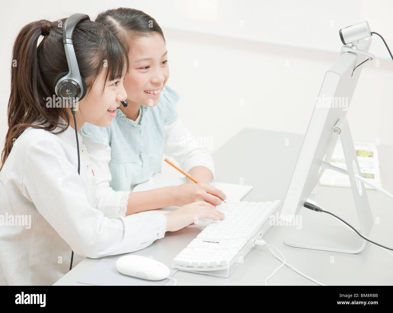 Girls Studying at Desk, Desktop Computer on the Desk Stock Photo - Alamy