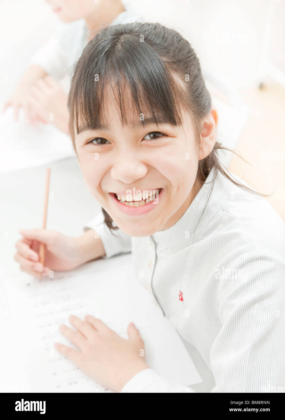 A Girl Studying at Desk Stock Photo - Alamy