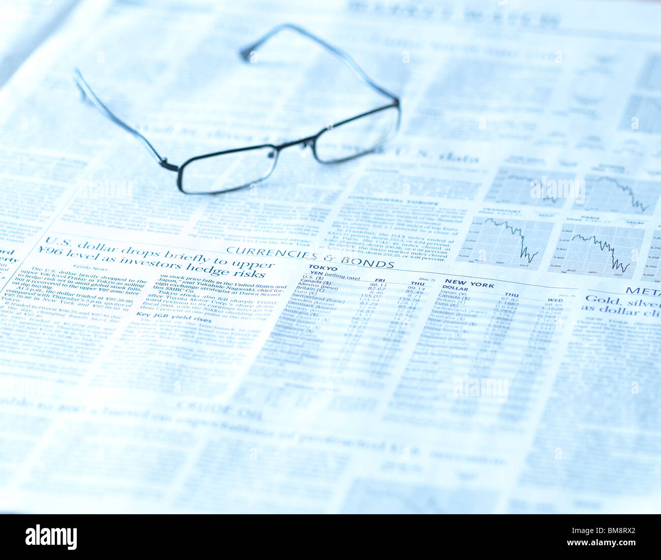 Glasses on English Newspaper Stock Photo