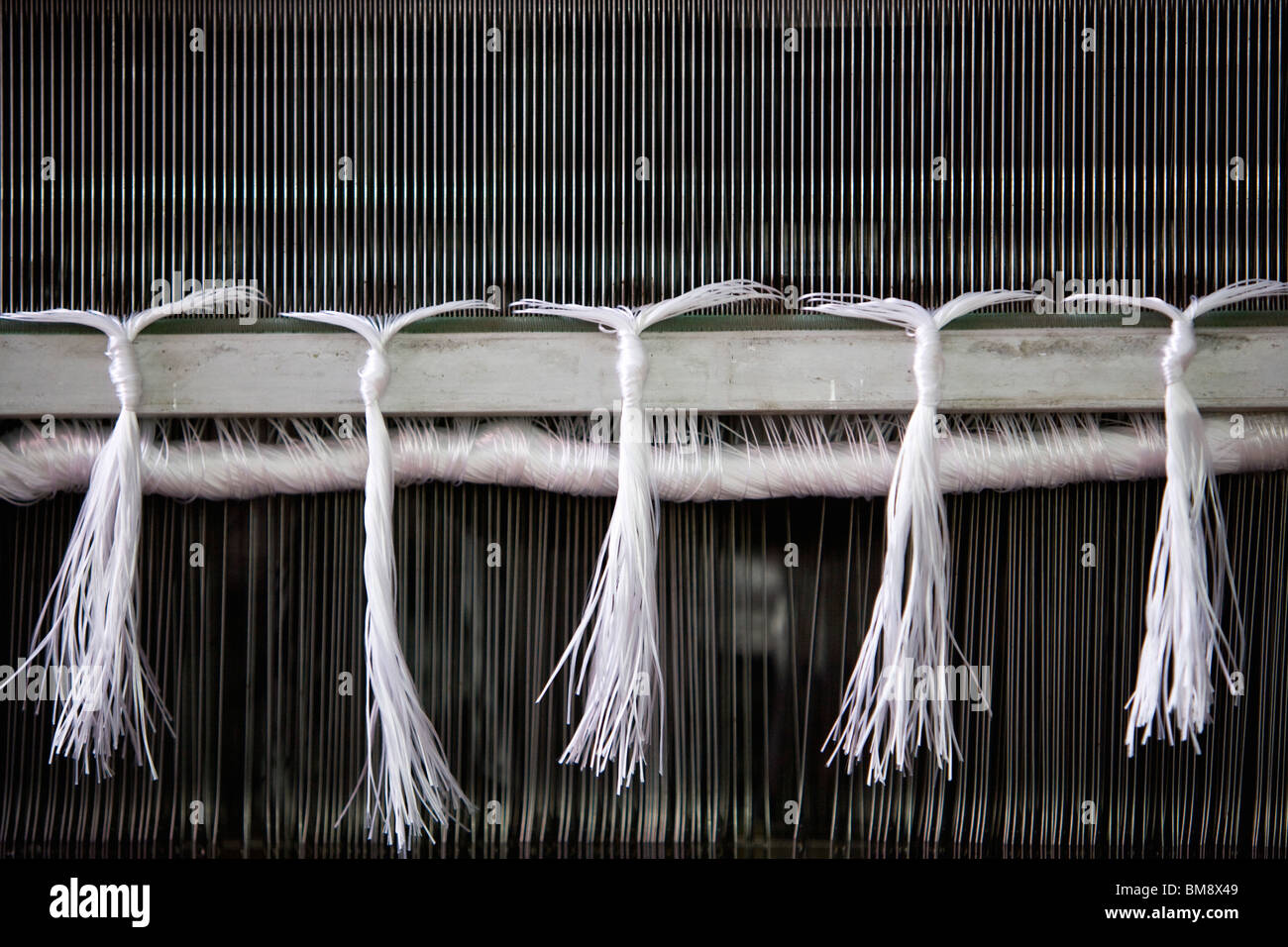 Loom in weaving mill, closeup of weaving reed Stock Photo Alamy