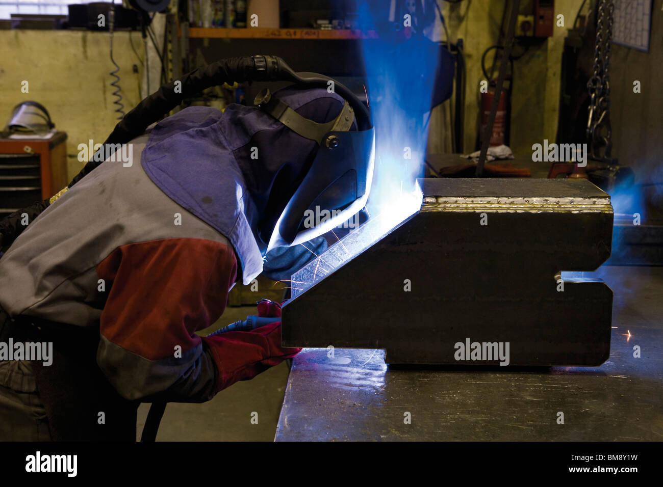 Coated textile plant, maintenance welder performing arc