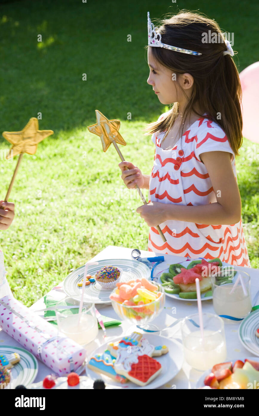 Girl in costume at outdoor birthday party Stock Photo Alamy
