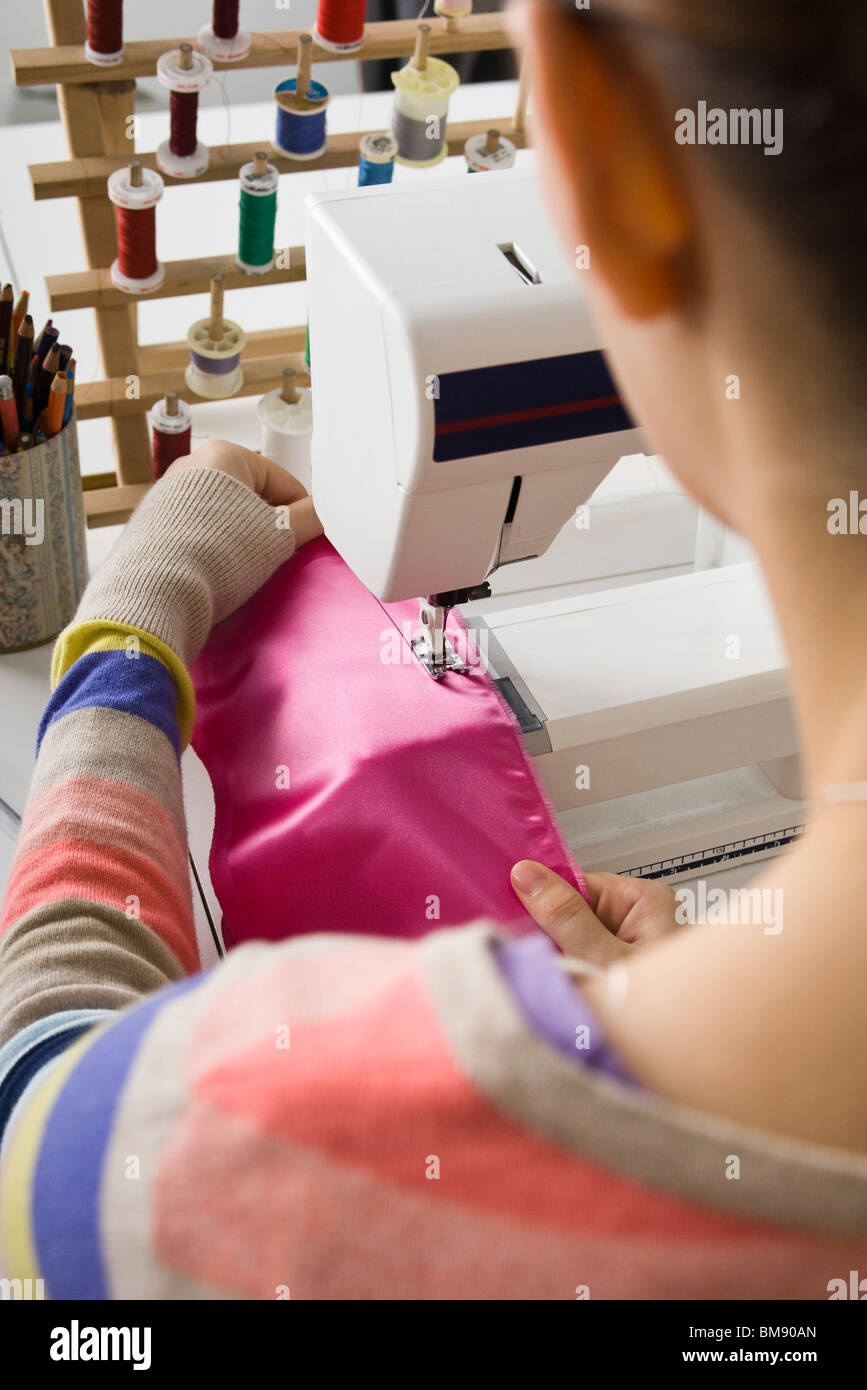 Seamstress sewing on sewing machine Stock Photo Alamy