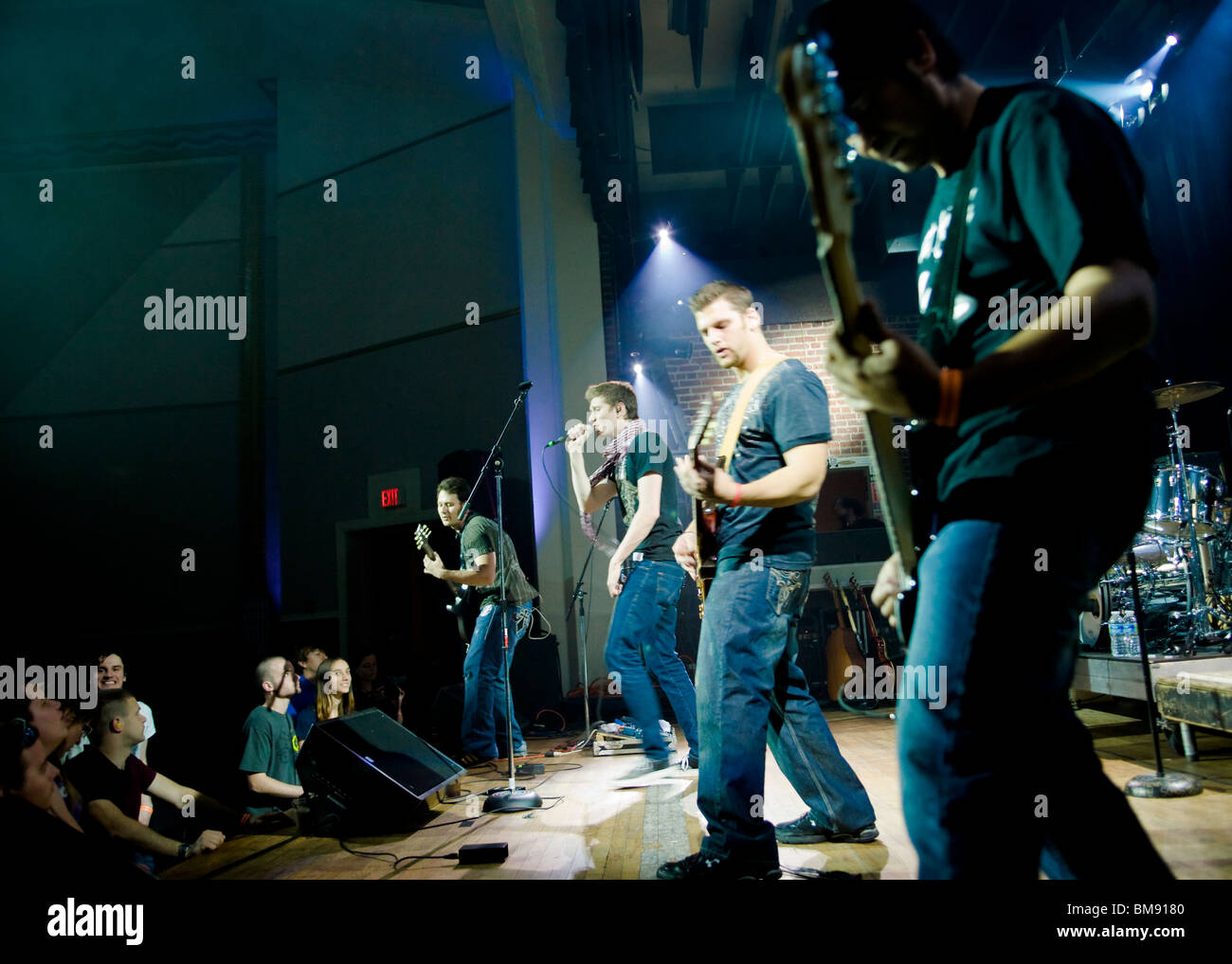 Rock band playing on stage Stock Photo Alamy