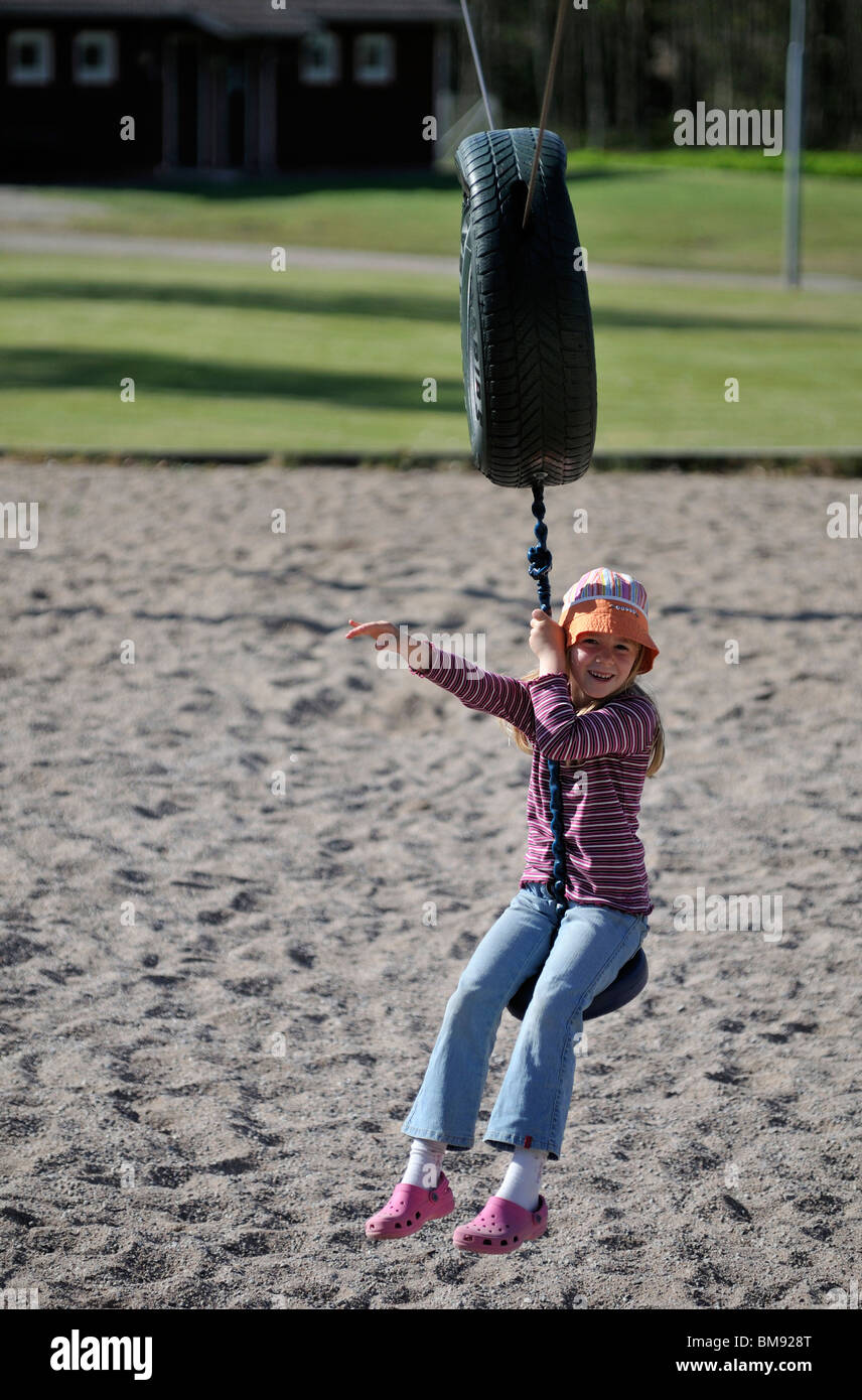 Girl on rope swing, Norrkoeping, Ostergotlands Lan, Sweden Stock Photo