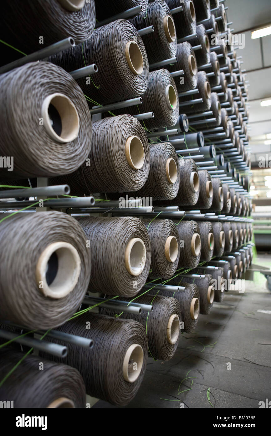 Fabric coating plant, weaving department, unwinding creel Stock Photo